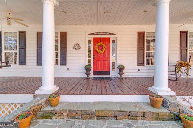 view of exterior entry with ceiling fan