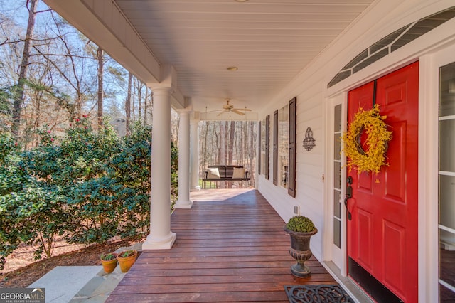 exterior space featuring ceiling fan and a porch