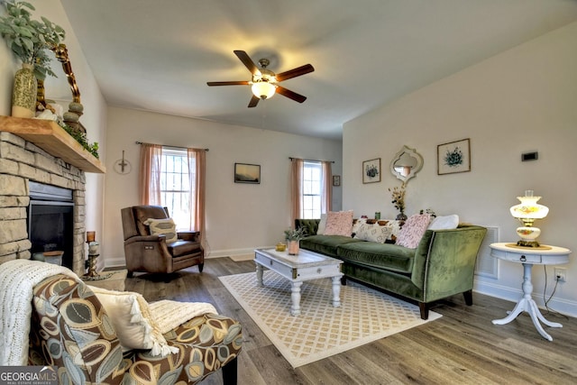 185 Sundown Trl, Ellijay, GA 30540 - living room featuring a ceiling fan, wood finished floors, and a fireplace