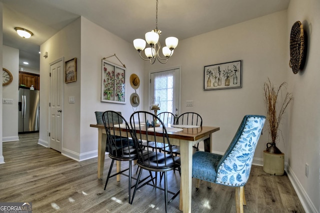 185 Sundown Trl, Ellijay, GA 30540 - dining area featuring wood finished floors and a chandelier