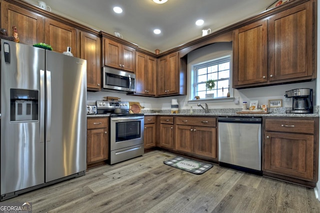 185 Sundown Trl, Ellijay, GA 30540 - kitchen featuring appliances with stainless steel finishes, light wood-style flooring, stone counters, and recessed lighting