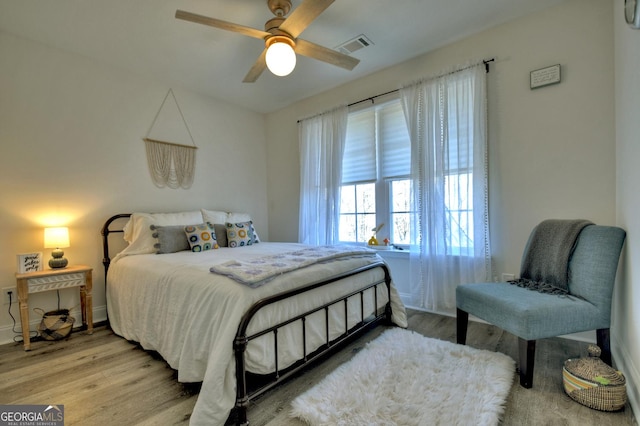 185 Sundown Trl, Ellijay, GA 30540 - bedroom with wood finished floors and ceiling fan