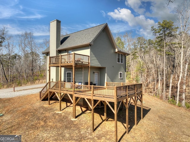 185 Sundown Trl, Ellijay, GA 30540 - rear view of property featuring a deck, a chimney, a shingled roof, and a balcony