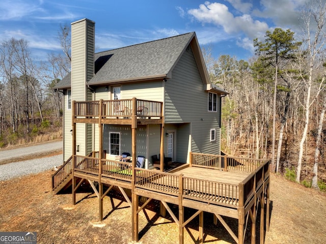 185 Sundown Trl, Ellijay, GA 30540 - back of house with a shingled roof, a chimney, and a wooden deck