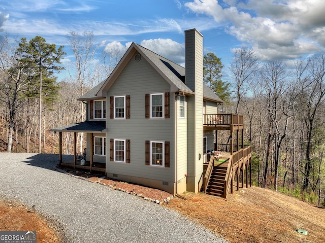 185 Sundown Trl, Ellijay, GA 30540 - view of side of home featuring crawl space, a chimney, stairs, a wooden deck, and covered porch