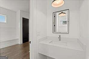 bathroom with vanity and wood-type flooring