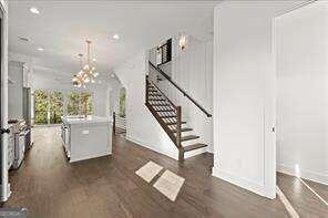 interior space featuring dark wood-type flooring and ornamental molding