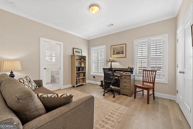 office featuring light hardwood / wood-style floors and ornamental molding