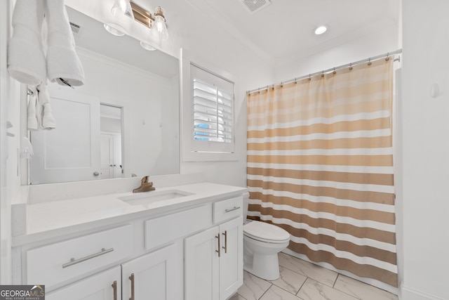 bathroom featuring vanity, crown molding, and toilet