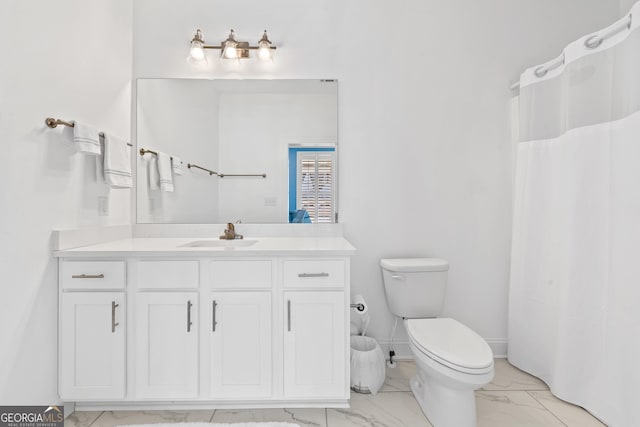 bathroom featuring vanity and toilet