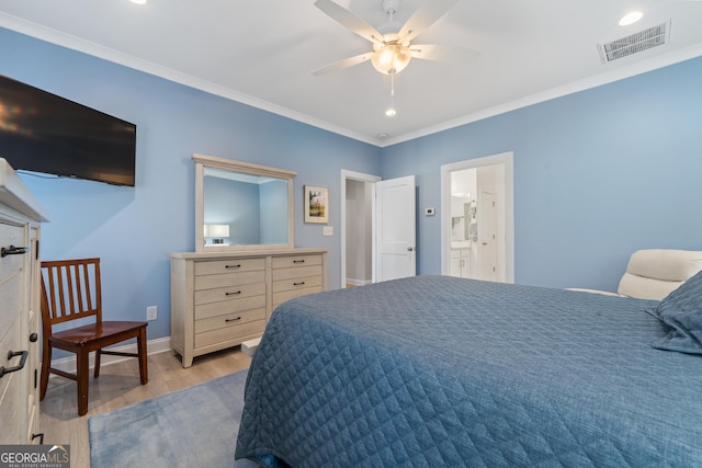 bedroom with light hardwood / wood-style flooring and ornamental molding