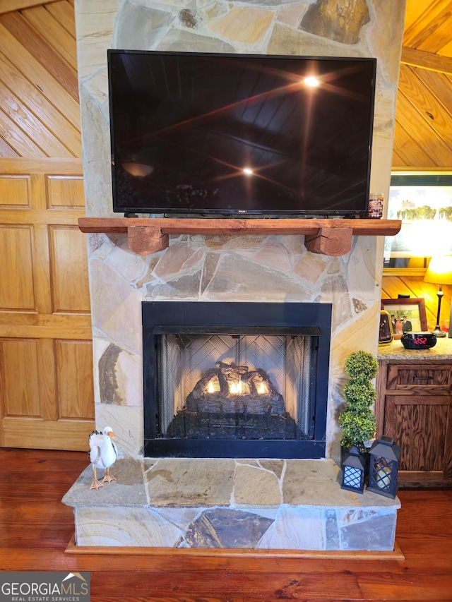 room details with hardwood / wood-style floors and a fireplace