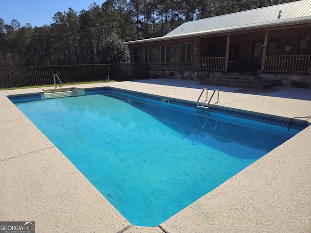 view of pool featuring a patio area