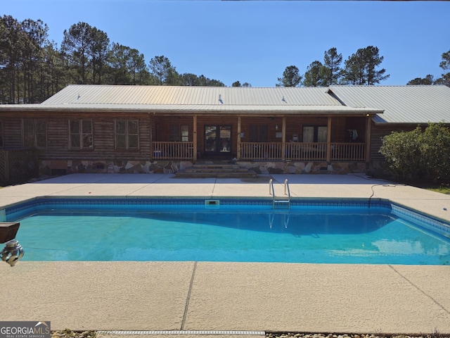 view of pool featuring a patio