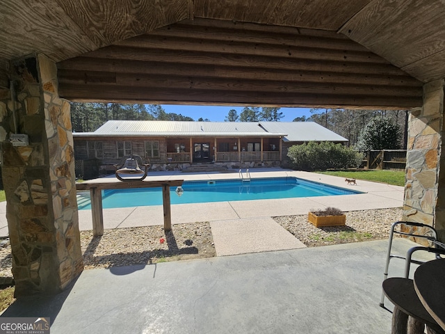 view of pool featuring a patio