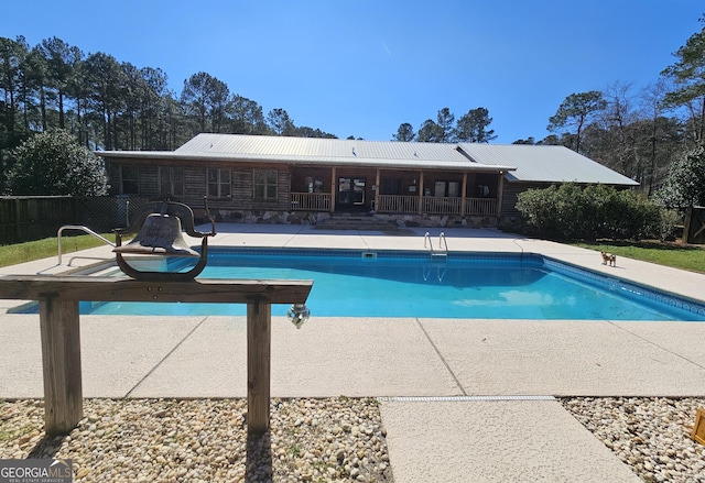 view of pool featuring a patio