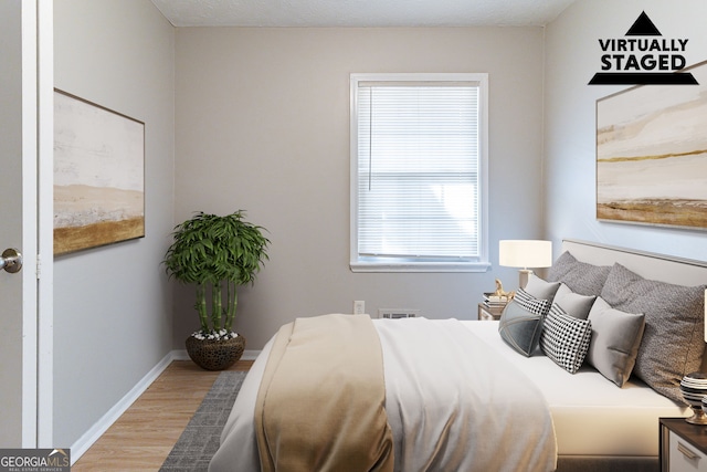 bedroom featuring hardwood / wood-style floors