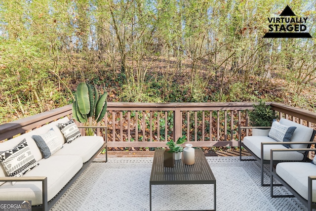 wooden terrace featuring an outdoor living space