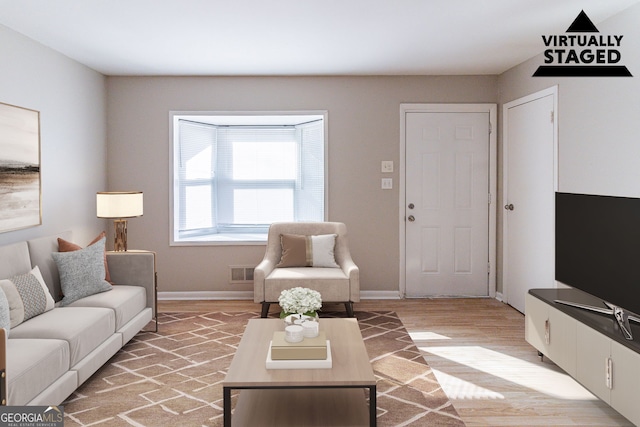 living room with light hardwood / wood-style floors