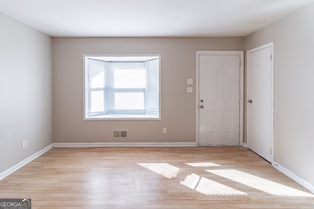 foyer with light hardwood / wood-style floors