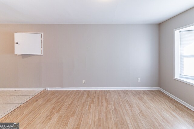 spare room featuring light wood-type flooring