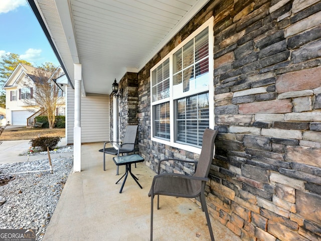 view of patio featuring a porch