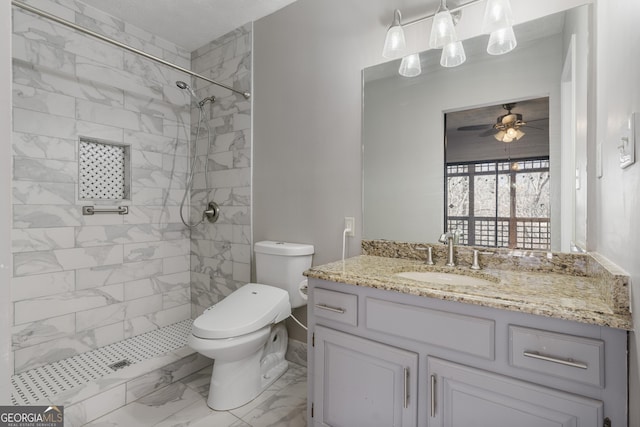 full bathroom featuring toilet, vanity, a ceiling fan, marble finish floor, and a stall shower