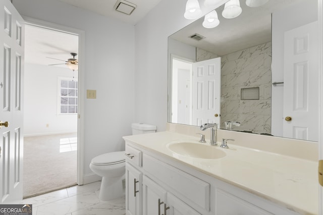 bathroom featuring baseboards, visible vents, toilet, marble finish floor, and vanity