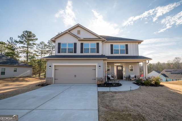 craftsman inspired home with a garage and a porch