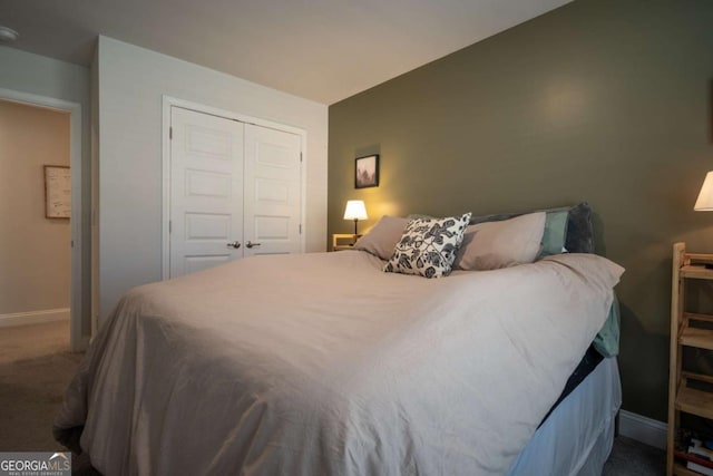 carpeted bedroom featuring a closet