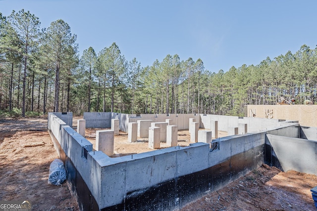 exterior space with a forest view