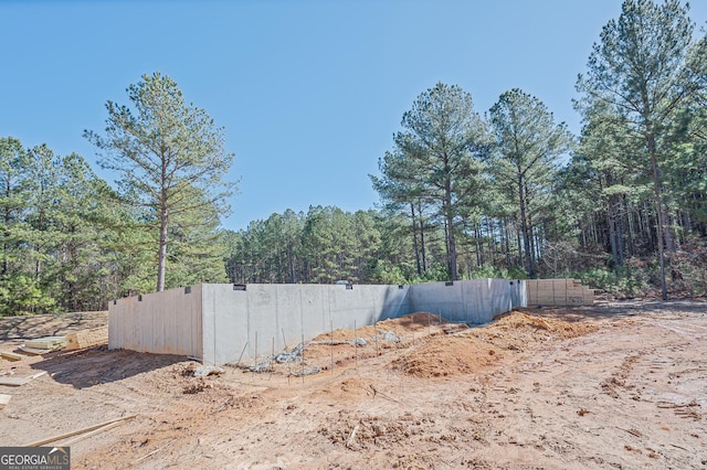 view of side of property featuring fence