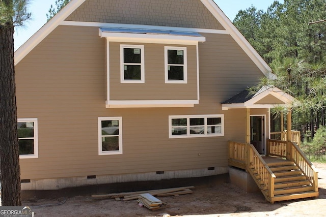 back of house featuring crawl space