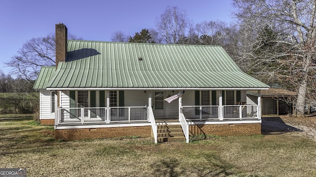 view of front of home featuring covered porch and a front yard