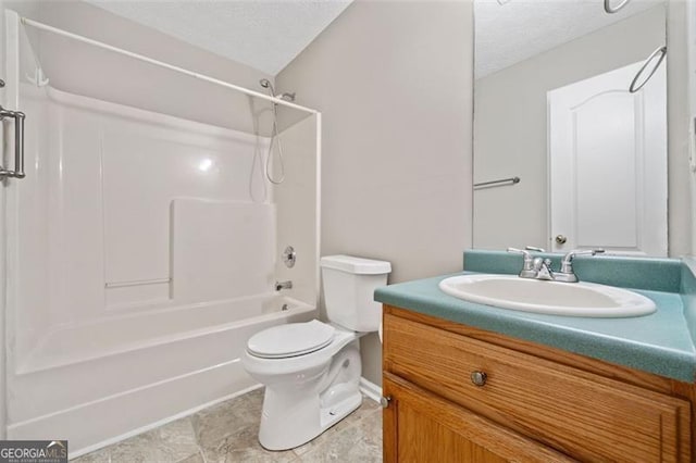 full bathroom with a textured ceiling, toilet, vanity, and  shower combination