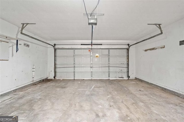 garage featuring a garage door opener