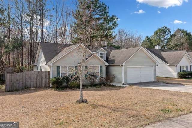 view of front of home featuring a front yard and a garage