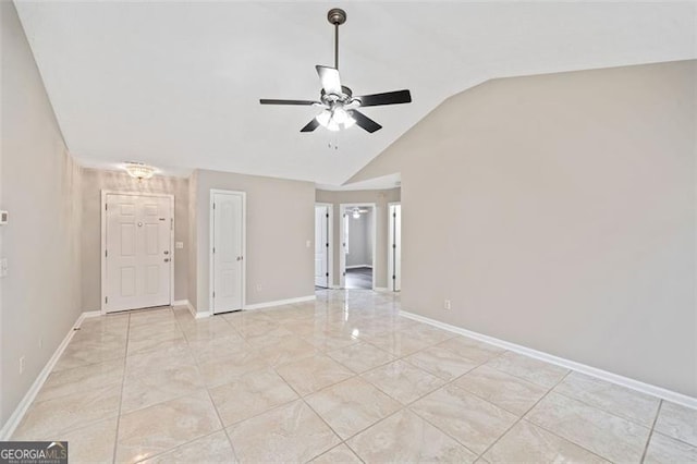 spare room with lofted ceiling and ceiling fan