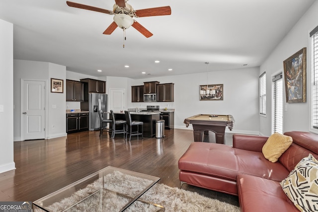 living room with billiards, baseboards, dark wood-type flooring, and recessed lighting