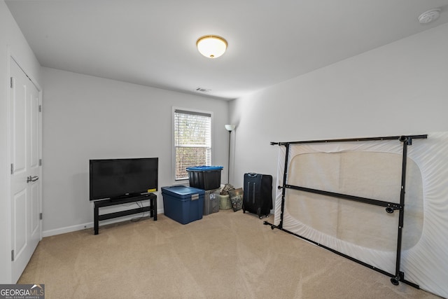 bedroom with carpet, visible vents, and baseboards