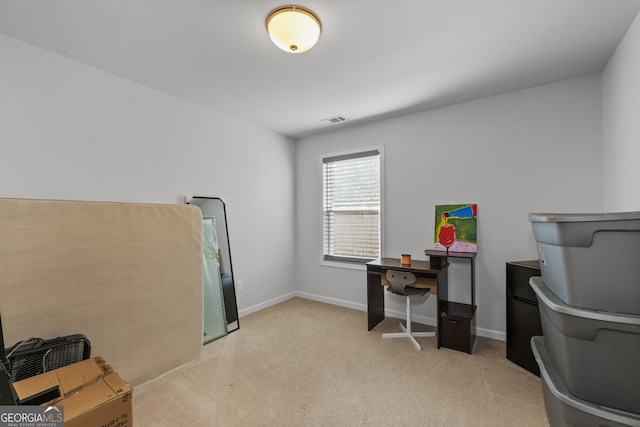 office space with visible vents, baseboards, and light colored carpet