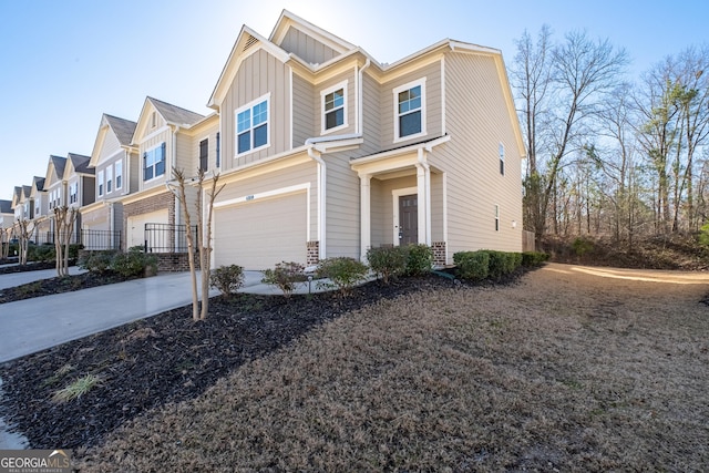 multi unit property with board and batten siding, a residential view, concrete driveway, and a garage