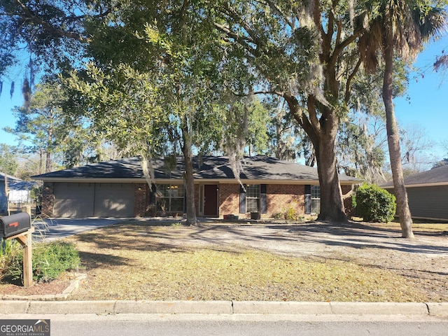 single story home featuring a garage