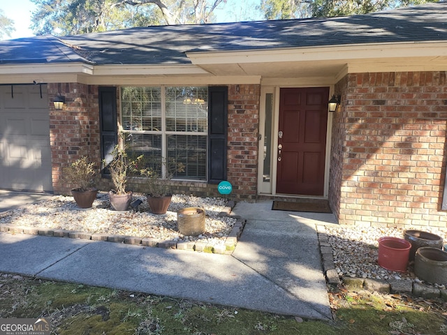 property entrance with a garage