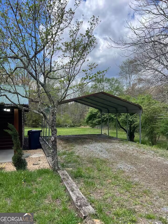 view of yard with a carport