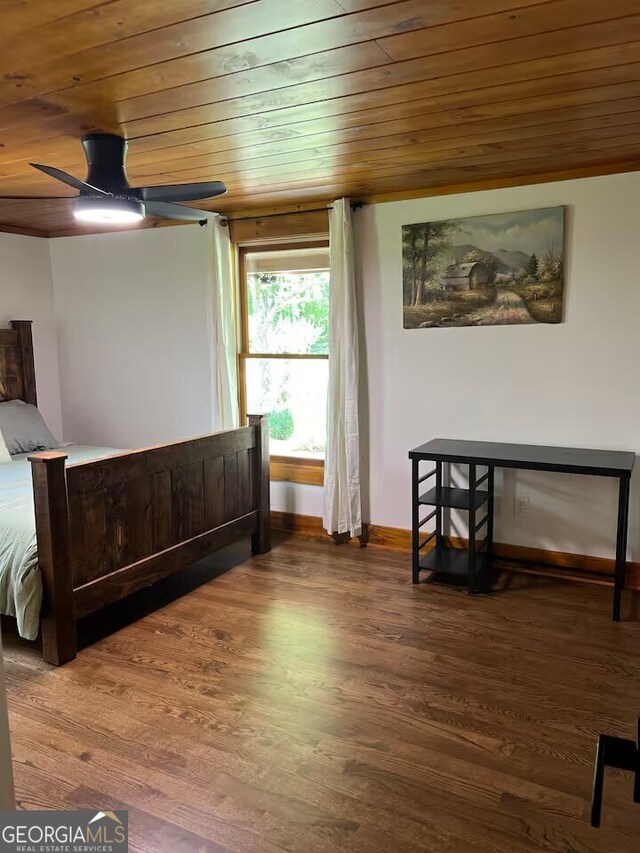 bedroom with wooden ceiling and wood-type flooring