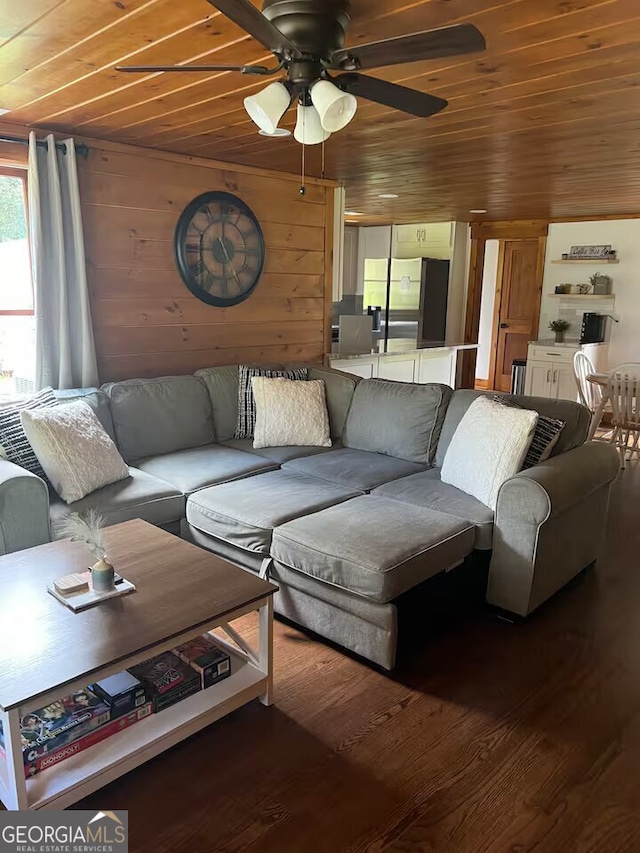 living room with hardwood / wood-style floors, ceiling fan, wooden walls, and wooden ceiling