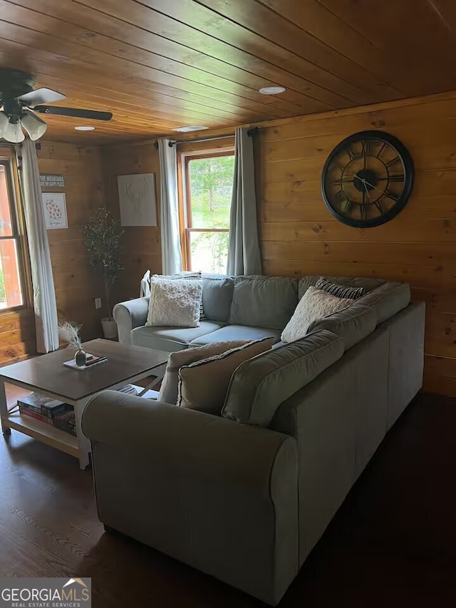 living room featuring wooden walls and wooden ceiling