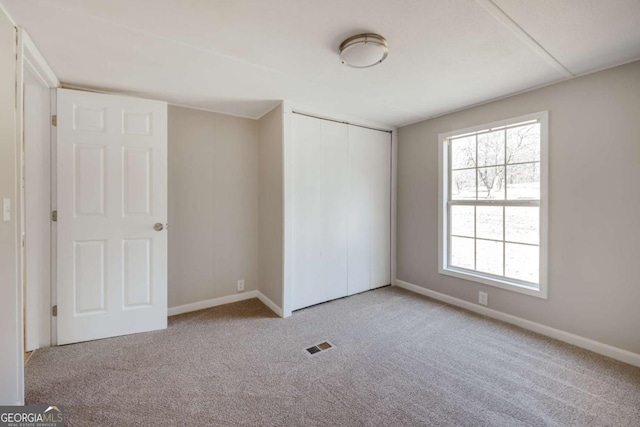 4419 New Kings Bridge Rd, Nicholson, GA 30565 - unfurnished bedroom with carpet, baseboards, and a closet