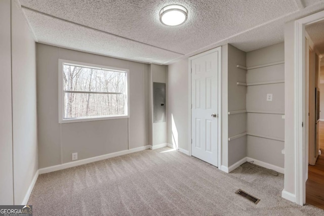 4419 New Kings Bridge Rd, Nicholson, GA 30565 - unfurnished bedroom featuring carpet, baseboards, a closet, and a textured ceiling